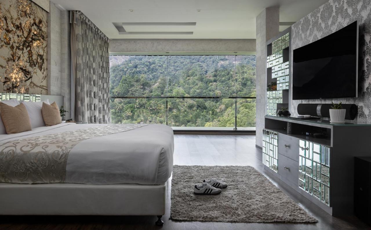 ザ パノラミック ゲートウェイ ホテル ムンナール エクステリア 写真 A bedroom at the hotel