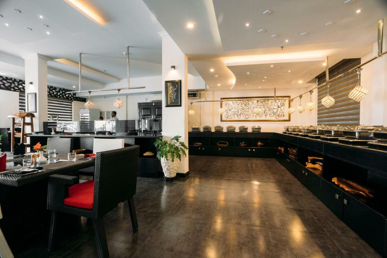 ザ パノラミック ゲートウェイ ホテル ムンナール エクステリア 写真 The interior of the restaurant